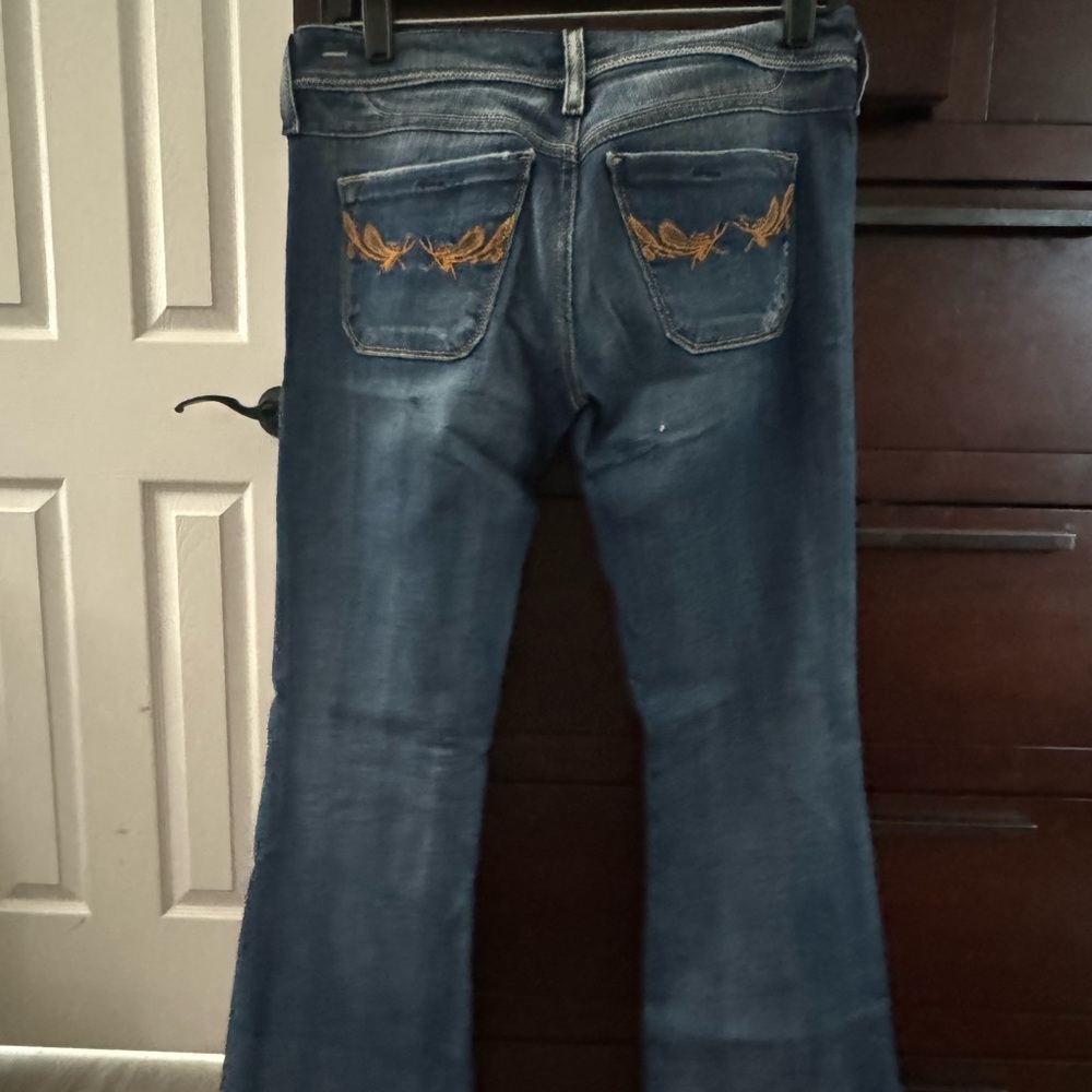 Diesel low rise jeans. Been altered to around 30 inches in length. Never worn.
